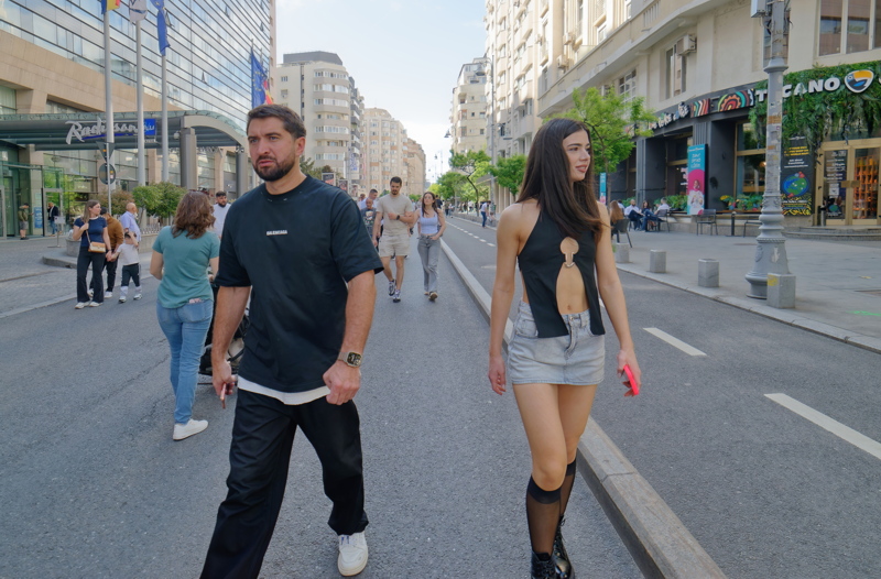 01 - A lively street scene in Bucharest, a prominent avenue often transformed into a pedestrian-only zone during summer weekends